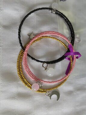 Q - Handmade memory wire bracelets set with beads and pendants